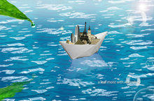 创意纸船承载世界梦想PSD素材