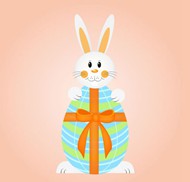 卡通抱彩蛋的兔子矢量图片