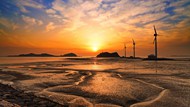 唯美黄昏落日海岸海滩风车精美图片